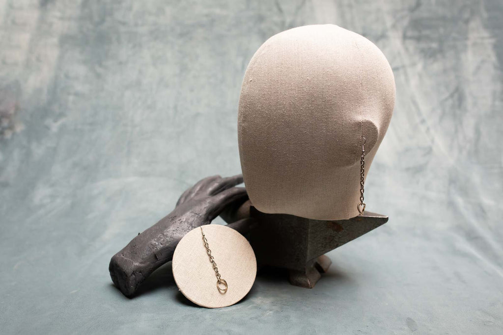 Long Chain earrings shown worn. Earrings industrial feel in two contrasting metals, silver and brass 