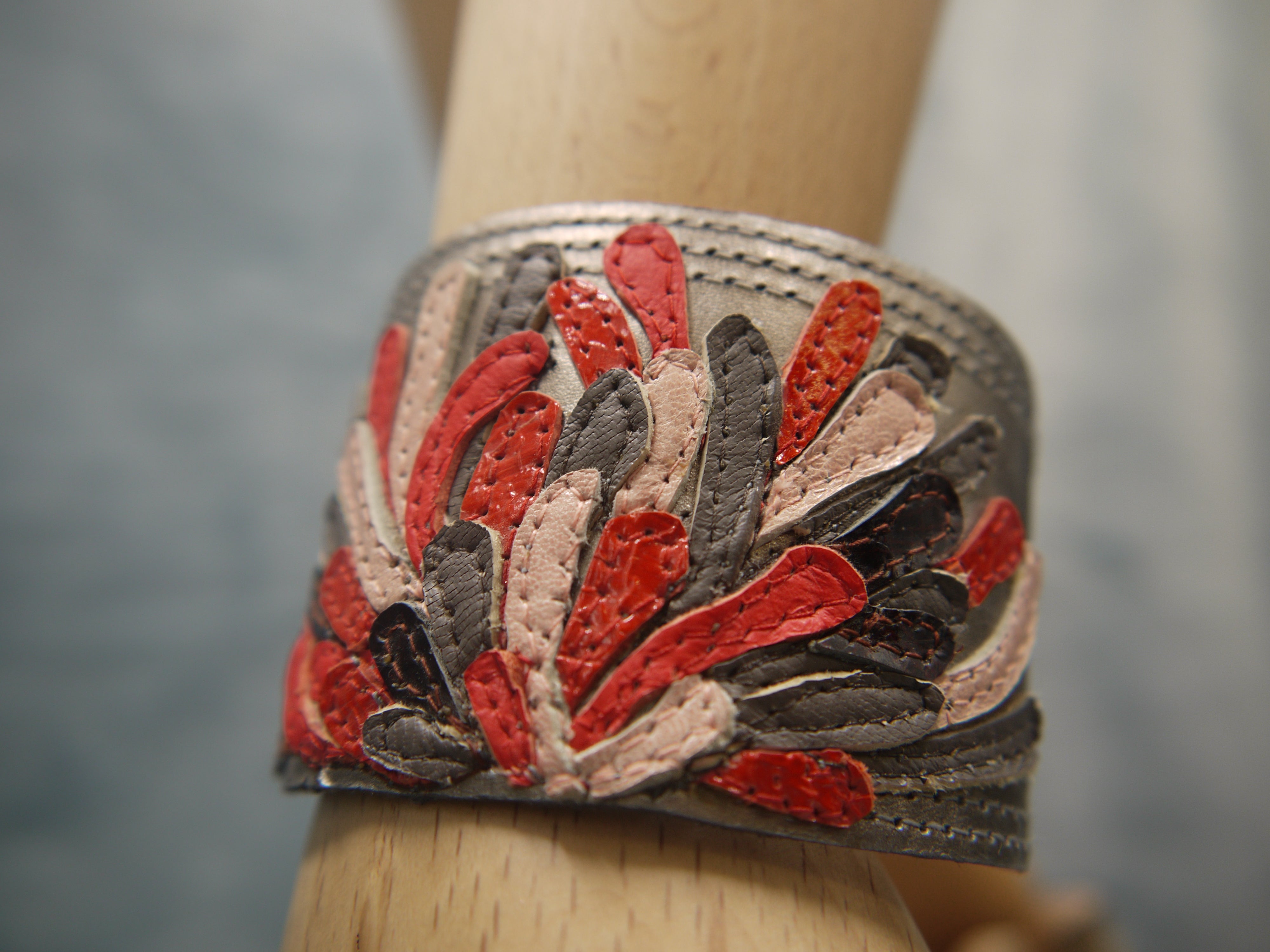 Chysanthemum Leather Cuff with hand-cut petals in vermilion, brown and pale pink, one-of-a- kind, unique, made in Italy by designer-makers
