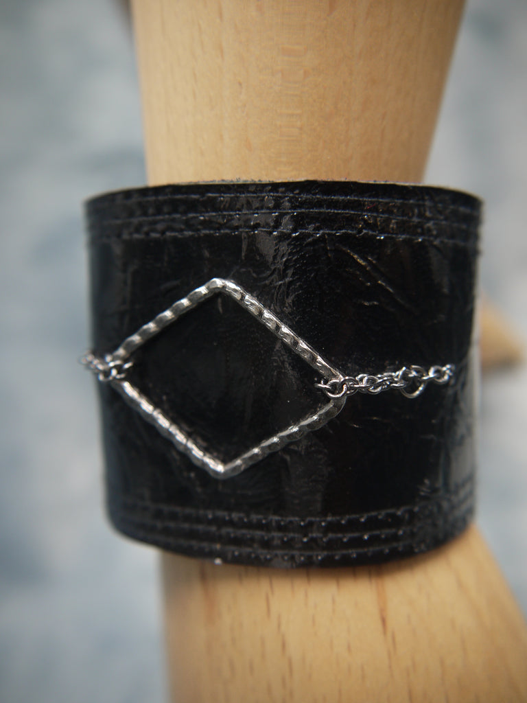 Leather Cuff Moss Midnight Blue Patent Leather with Metal Diamond Element. Repeat stitch detail underlines the edge of the cuff