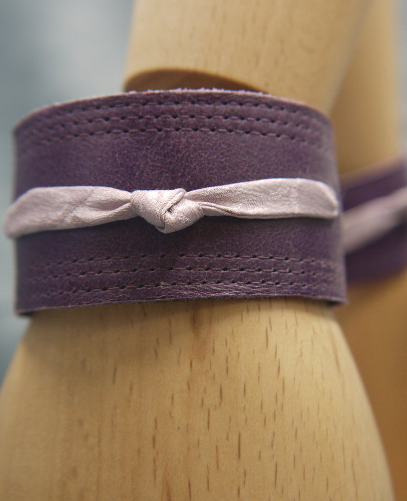Royal Purple slimline Italian leather cuff with lilac slim silk knot central on the cuff. The cugff has elegant repeat stitch detail around the edges. Close-Up Image