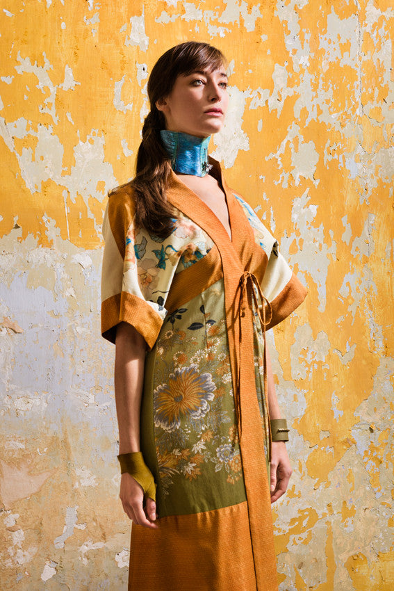 Model wears Kimono Shirt Dress in shaded olive green floral print and burnt orange silk